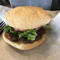 Impossible burger with tomatoes, onions and lettuce  at Brothers BBQ in Broomfield
