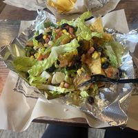 Nachos with vegan green chile and no queso  at Illegal Pete's  - Pearl St. Mall in Boulder