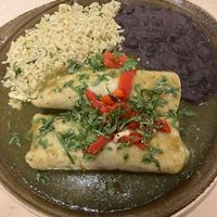 Enchiladas de Aquacate from the vegan menu. Avocado, poblano peppers & artichoke enchiladas topped with tomatillo sauce, cilantro & roasted red peppers. 2 thumbs up! at Cantina Laredo in Bloomington