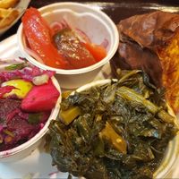 Clockwise from the top: tomato salad, sweet potato, collards, apple & beet salad, fries at Sweet Home Cafe in Washington