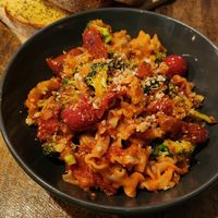 Garlic bread and Mafaldine with broccoli and tomatoes at Maccaroni Trattoria Italiana in Melbourne