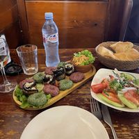 Assorted pkhali including badrijani, tomato-cucumber-salad and bread  at Pasanauri - Giorgi Leonidze in Tbilisi