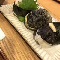 Vegan onigiri (lotus leaf, mushroom and soy meat one)  at Musubi Cafe - Gion Kamogawa in Kyoto