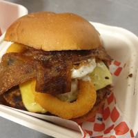 The Dirty Boy (smash patty, cheese, onion rings, facon, bbq sauce, aioli) NZ$16.90: YUM at Wise Boys Burgers in Auckland