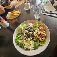 Nudelsallad i förgrunden och pannkakor i bakgrunden. at VeGofika Göteborg in Gothenburg