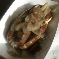 Bratwurst sausage with sauerkraut and onions  at Vegan Brüder in Fort Lauderdale