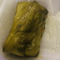 Mung bean cake wrapped in a banana leaf  at Wheel of Life in Irvine