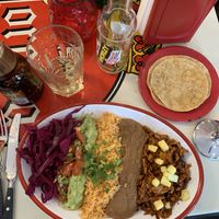 ‘plato’ with planted pastor, rice, cabbage, guacamole, beans and pineapple. served with tortillas   at La Taqueria - Kreis 4 in Zurich