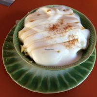Hot breakfast- soaked grains with goji berries, Apple, banana, rice milk and vanilla custard at Tushita in Munich