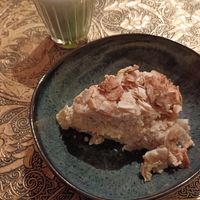 Smallest matcha in the world (5,8€) and a piece of a cake. at Tushita in Munich