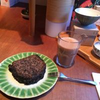 Chai latte and slice with black sesame paste. Both very yummy.  at Tushita in Munich