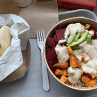 Warm healthy bowl w/ quinoa beets chickpeas avocado and sweet potatoes, tofu skin bao bun  at Spring Cafe in New York City