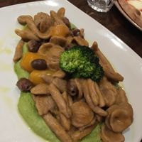 Homemade pasta with tomatoes, olives and broccoli purée  at Terra Rossa in North London