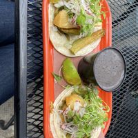 Vegetarian tacos with side of beans  at Papi's Tacos in Baltimore