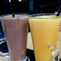 Chocolate chia smoothie and fresh orange juice at Veggies in Tirana