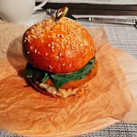 vegan burger with baked eggplant, falafel , fresh tomatoes, spinach and spicy sauce at Latuk in Moscow