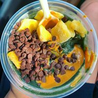 Green acai base with mango, peanut butter, chocolate chips, and lavender.  at Hatteras Bowls in Waves