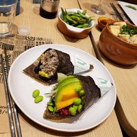 Mushroom + guacamole handroll, mango, tofu, and edamame handroll  at Yasai Natural Sushi in Rio De Janeiro