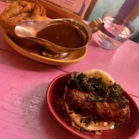 Pigs in blanket bao with with a yorkie pudding and gravy   at Wholesome Junkies in Manchester