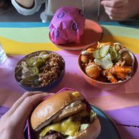 Truffle burger with mac and cheese (left) and buffalo tater tots (right)  at Wholesome Junkies in Manchester