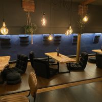 Dining in the back room with option to sit on the floor   at Wholesome Junkies in Manchester