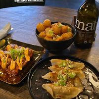 Clockwise from top: salt and pepper tots, grilled dumplings, Korean poppers. at Wholesome Junkies in Manchester