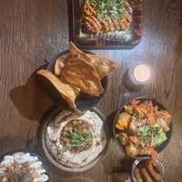 Tofu poppers, hummus and pita chips, Mac and cheese, onion rings, and kimchi tots   at Wholesome Junkies in Manchester