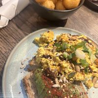 Tater tots, tofu scramble and avocado toast  at Wholesome Junkies in Manchester