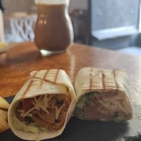 Wrap chi y al fondo batido tornado con leche vegetal at Cafe La Lola  in Gran Canaria
