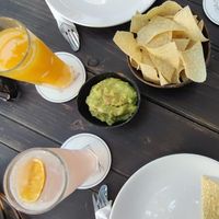 Nachos with guacamole, orange juice and pink lemonade at Orenda in Beirut