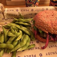 Panino del mese: funghetto burger con burger di seitan, cavolo rosso marinato, rucola, smoky humus, funghi e salsa maio fungosa più edamame  at Flower Burger in Bologna