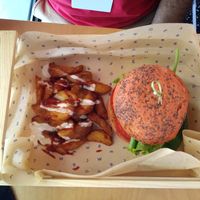 Spicy Chickpea burger and patatas bravas at Flower Burger in Bologna