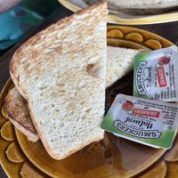 Side of sourdough with jelly - they also have vegan butter available upon request   at The Toasted Owl Cafe - Cortland Blvd in Flagstaff