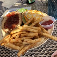 Rainbow burger (sweet potato version) with vegan cheeze and tomato jam  at The Toasted Owl Cafe - Cortland Blvd in Flagstaff