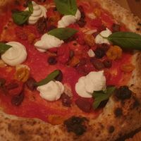 confit date tomatoes, olives, vegan ricotta, basil at Piu - Schiffbau in Zurich