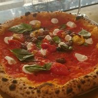 Pizza with vegan cheese at Piu in Zurich