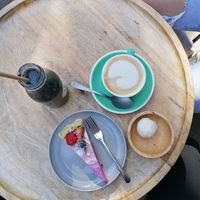 Charc coal smoothie, cappuccino, raw cake and coconut energy bliss ball at Plants & Cakes in Frankfurt