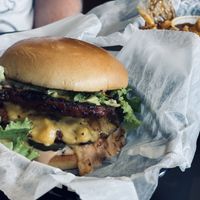 Anarchy burger with curly fries and bbq sauce at Seitan's Realm in Columbus