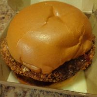 Chikun Parm to go.  House-made chikun patty on top of a toasted brioche bun, smothered in mozzarella cheeze and marinara sauce. Crispy and flavorful breading and the perfect chew to the patty. 
 at Seitan's Realm in Columbus