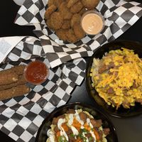 Jess’s Mess (bottom), Mozzarella sticks (left), fried pickles (top), chicken special plate (right)  at Seitan's Realm in Columbus