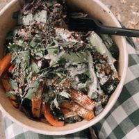 Sourdough bread with hummus, tahin and krautenöl, the bread is hidden under all the veggies. So good!! at ÆNDRÈ in Hamburg