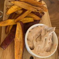 Sweet potato fries alongside vegan mayo  at The Source Cafe in Siem Reap