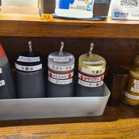 Clearly labelled sauces at Menkui Kinya in Kyoto