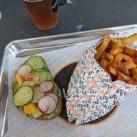 Avocado toast with french fries and beer on tap at HUMBL in Orlando
