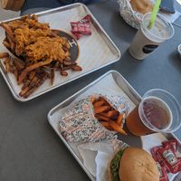 Sweet potato fries with a hamburger and beer on tap. Friend's plate was loaded fries (i forget the menu names) at HUMBL in Orlando