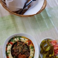 Hummus with mushrooms, pickles and pita bread at Akkawy in Berlin