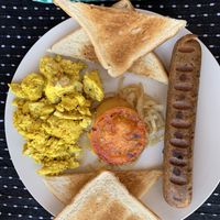 The Barn Style Breakfast - toast, fried onion, fried tomato, tofu scramble, seitan boerewors sausage. at Ashers Farm Sanctuary in Pretoria