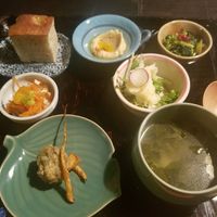 assortment of small dishes, including focaccia, hummus and potato salad at Hale in Kyoto