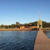 The bistro is on the left where you see the green parasol. Took this picture from the end of a long dock just in front. at Bistro Pointe Taylor in New Richmond