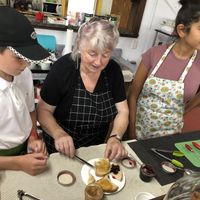 Louise showing her home made jams to Mathis (employee) and Keshani (manager). at Bistro Pointe Taylor in New Richmond